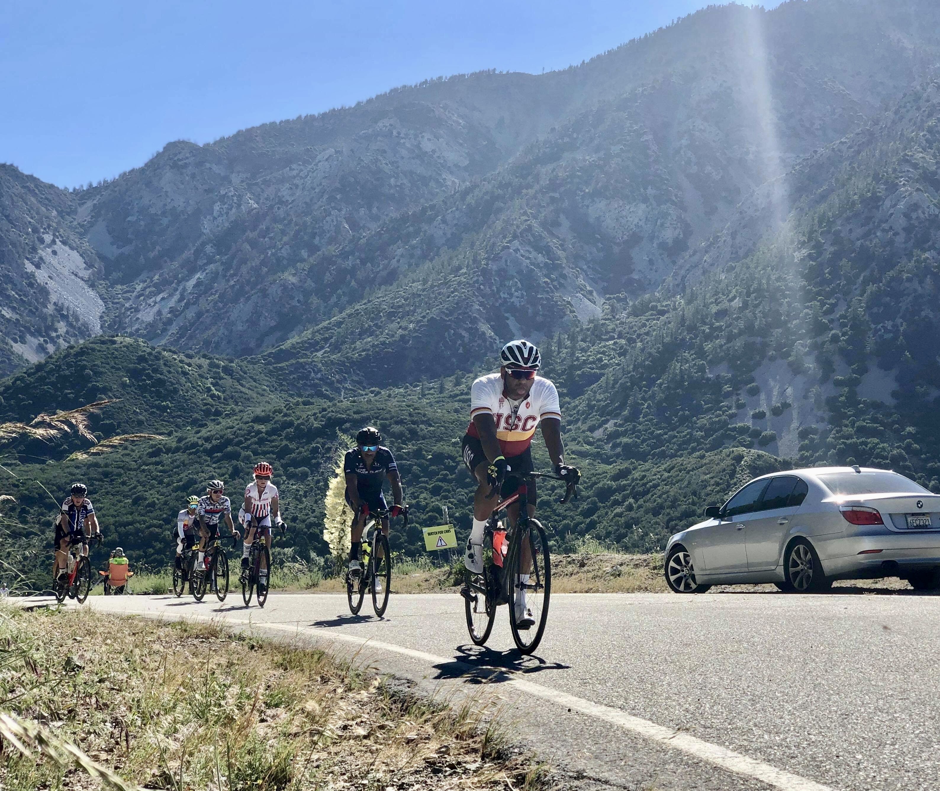 Road cyclists climbing a mountain pass